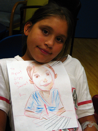 Alyssa with a portrait, drawn by Rami Efal
